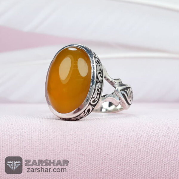 انگشتر عقیق زرد شرف شمس دست ساز همراه حرز امام جواد(ع) و تربت عکس انگشتر عقیق زرد شرف شمس دست ساز همراه حرز امام جواد(ع) و تربت