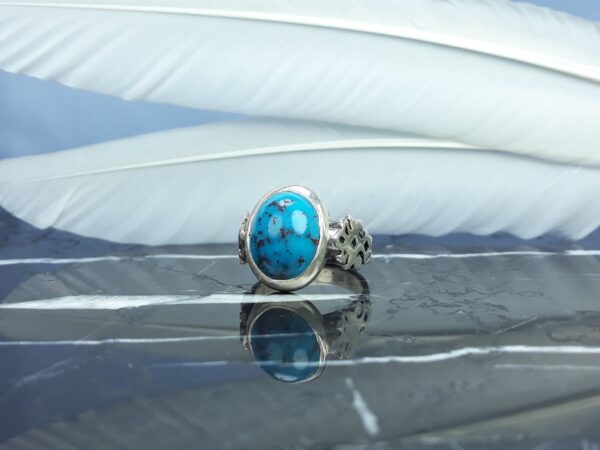 انگشتر فیروزه نیشابوری احیاء شده دست ساز همراه حرز امام جواد عکس انگشتر فیروزه نیشابوری احیاء شده دست ساز همراه حرز امام جواد