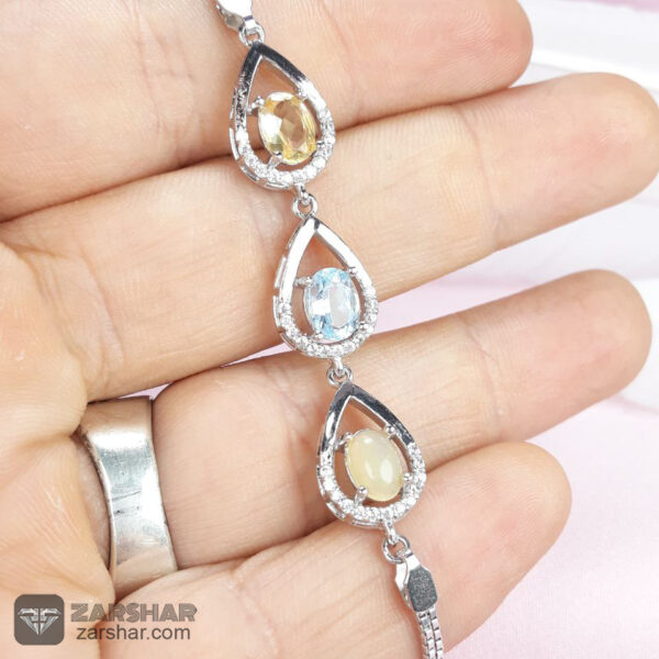 دستبند نقره سه نگین جواهری اپال و توپاز و کوارتز عکس دستبند نقره سه نگین جواهری اپال و توپاز و کوارتز