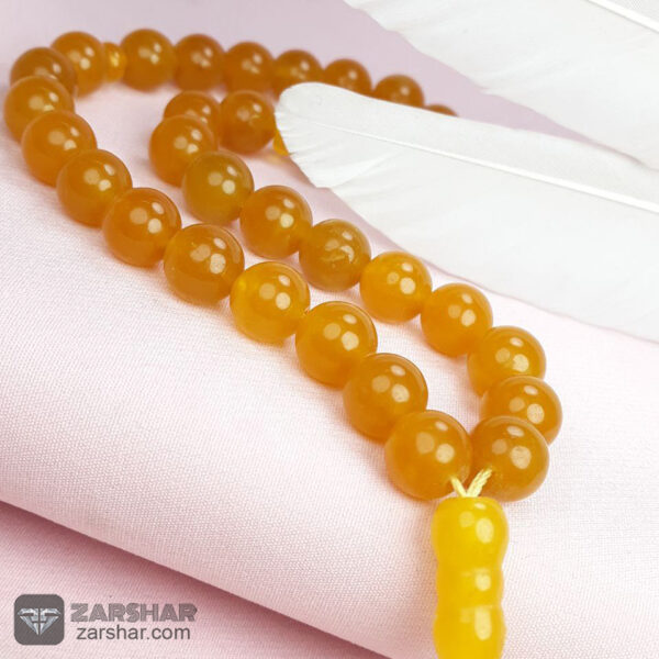 تسبیح جید زرد شرف الشمس 33 دانه، دانه درشت عکس تسبیح جید زرد شرف الشمس 33 دانه، دانه درشت