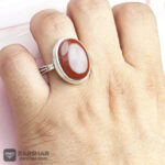 عکس انگشتر عقیق یمنی سرخ همراه حرز امام جواد(ع) و تربت